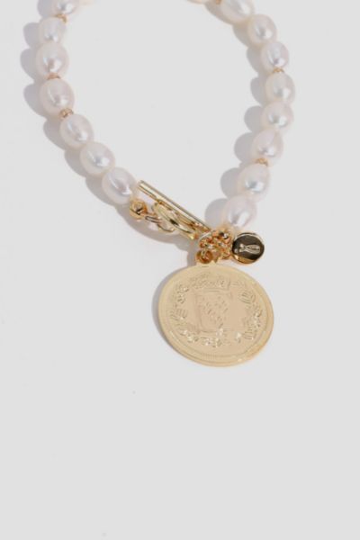 Enhance your baby girl's delicate beauty with our exquisite pearl bracelets. Handcrafted using genuine pearls, these timeless accessories exude elegance and grace, perfect for special occasions or everyday wear.