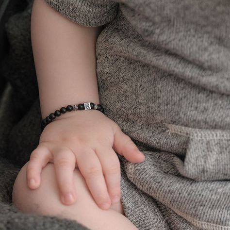 Adorn your baby boy's wrist with our charming bracelets. Crafted from hypoallergenic materials like sterling silver, silicone, or nylon cords, these bracelets are safe and comfortable for delicate skin