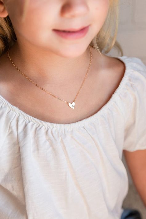 Adorn your little princess with our exquisite baby girl necklaces. Crafted from hypoallergenic materials, these dainty, yet durable pieces feature charming designs, delicate colors, and adjustable lengths, ensuring both safety and style for your precious one.