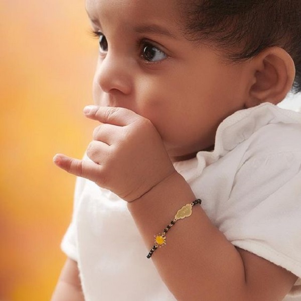 the tradition of babies wearing gold bracelets