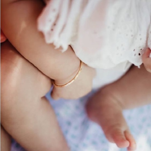 the tradition of babies wearing gold bracelets